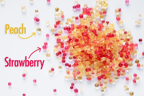 Each pack includes an assortment of peach and strawberry flavored beads.