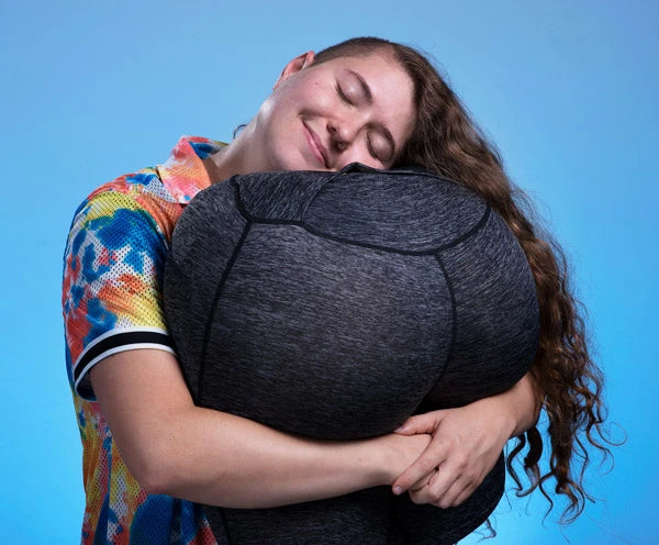 A soft foam pillow in the shape of a butt... with yoga pants!