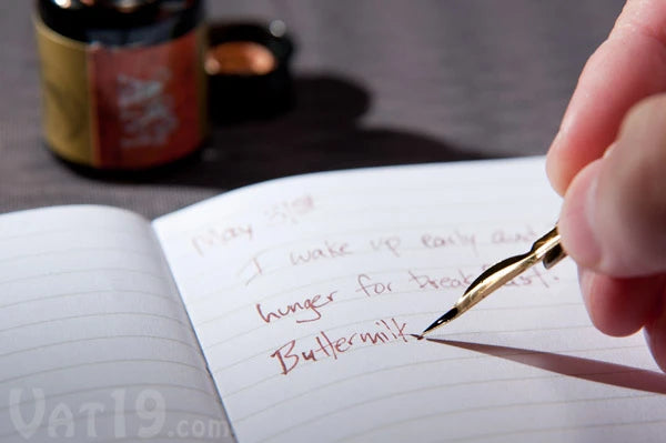 The Feather Pen Set includes a 0.71 fl oz vial of burnt sienna ink. Notice how it makes the lyrics from "Das Boot" ooze distinction.