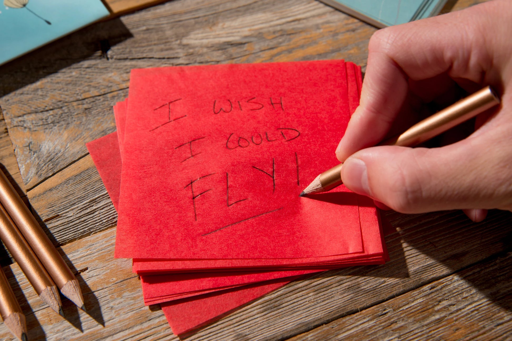 Begin by writing your most precious wish onto a piece of wish paper.