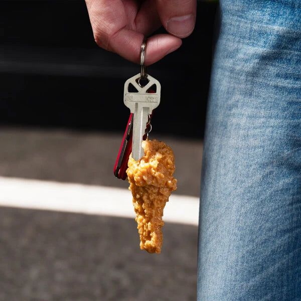Indulge your love for fried chicken anytime, anywhere with our Fried Chicken Keychain!