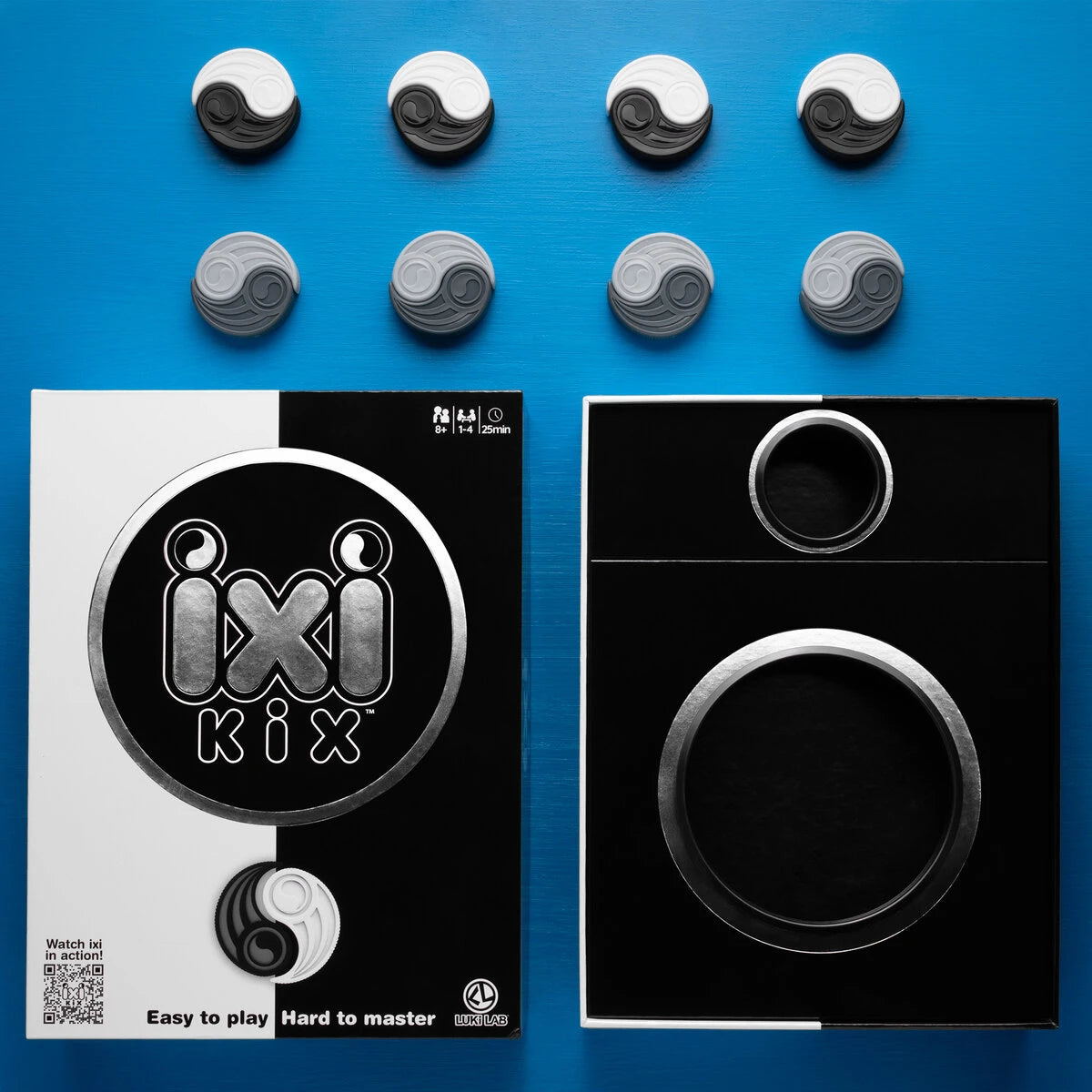 Includes: 16 Ixis (4 black, 4 white, 4 light grey, 4 dark grey), 2 target boxes, and instructions