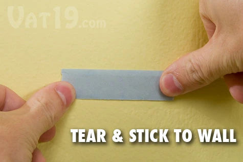 Step 1: Tear off a piece of tape and stick it to the surface.