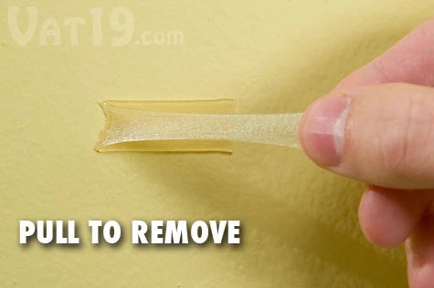 Use your fingernail to dig up a corner of Joe's Sticky Stuff™. Then pull to remove the tape. No sticky residue will be left behind.