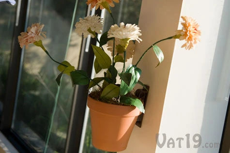 Hang flower pots almost anywhere inside or outside with the Pot Latch.