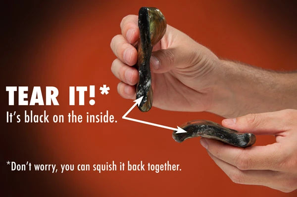 Super Illusions Putty appears black when ripped.