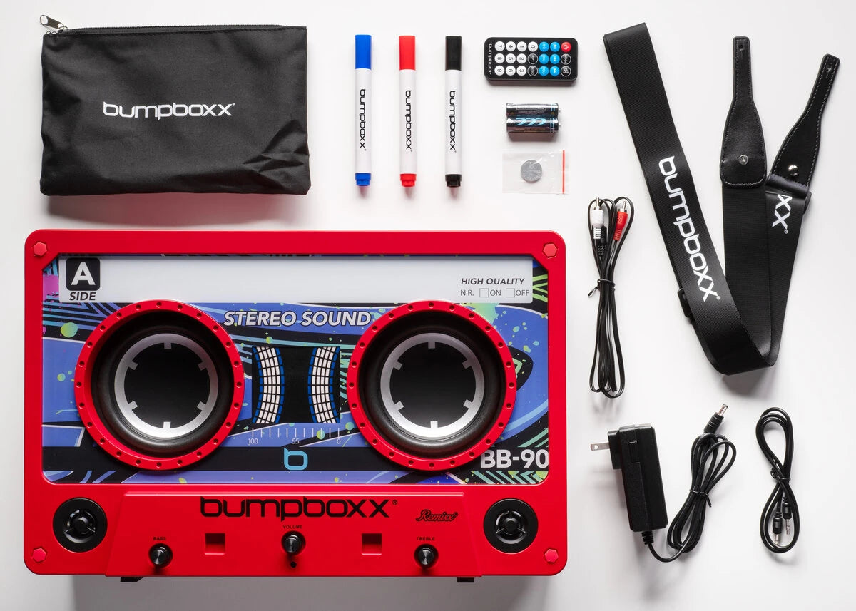 Includes: Charger and cable, carrying strap, remote control, wireless microphone (batteries included), dry erase markers, and a USB charging port.