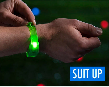 Strap on the included LED bracelets (8 green & 8 blue).