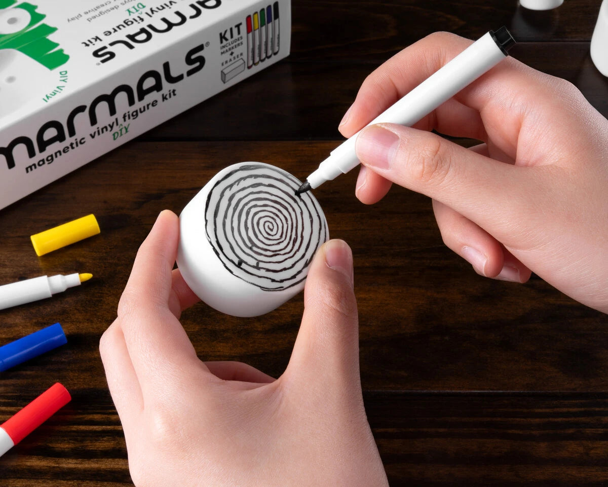 Use the included washable markers to temporarily (or permanently) decorate your Marmal.