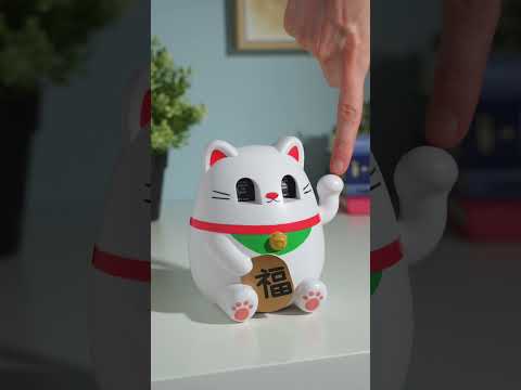 With each pull of this feline fortune-teller's playful paw, the Lucky Cat’s eyes spin like a slot machine and display fortuitous guidance.