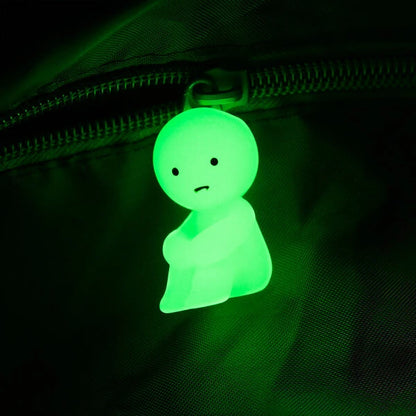 Smiski absorbs light and glows in the dark.