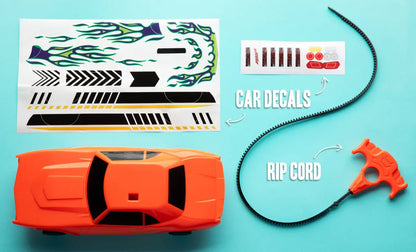 Includes the race car, rip cord, and two decal sticker sheets.
