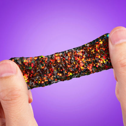 Stretch it, squeeze it, splat it, and watch the sparkles transform from green to orange as it moves through light.